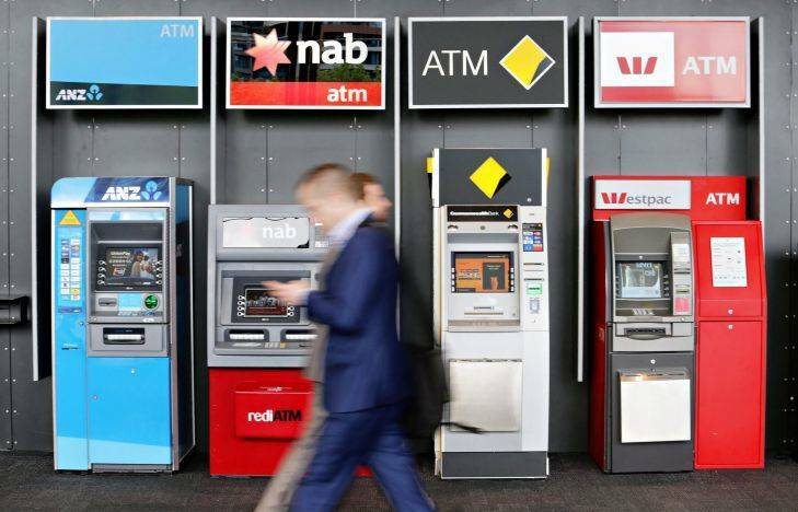 General view of people walking past bank ATMs. Photo by Paul Rovere/Fairfax Media