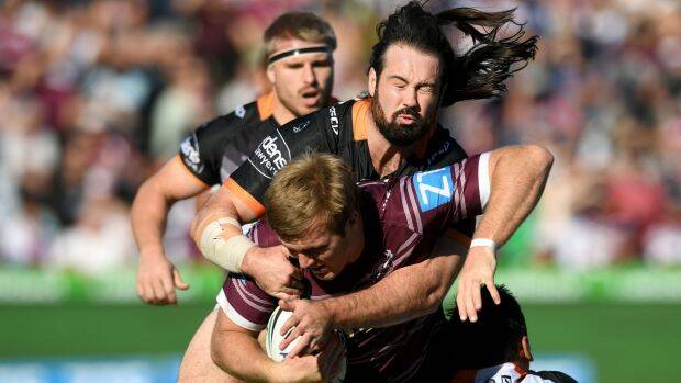 Big game: Tigers captain Aaron Woods put the disappointment of the Origin series behind him with a strong 80-minute individual performance against Manly. Photo: AAP