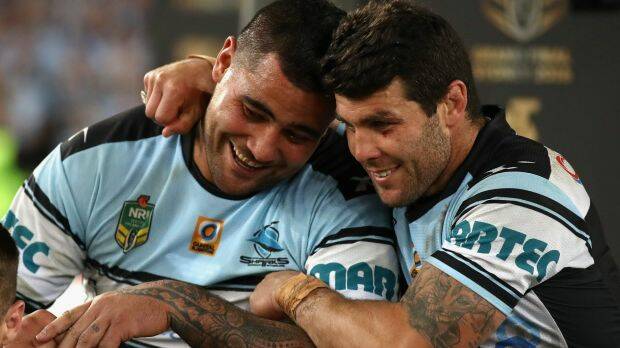 Special moment: Andrew Fifita celebrates the Sharks' premiership with Michael Ennis. Photo: Getty Images