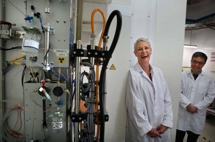 Former patient Elizabeth Doonan shares a laugh with clinical director of Nuclear Medicine, Dr Peter Lin in front of a Cyclotron at Liverpool Hospital where Elizabeth underwent successful state-of-the-art treatment for life threatening cancer. Photo by James Alcock/Fairfax Media