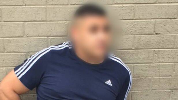 A man is arrested over a multimillion identity fraud syndicate. Photo: NSW Police