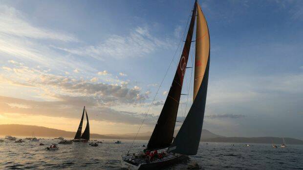 Runner-up Comanche, left, and Sydney to Hobart winner Wild Oats, right, on the River Derwent at the finish on Wednesday night. Photo: AAP