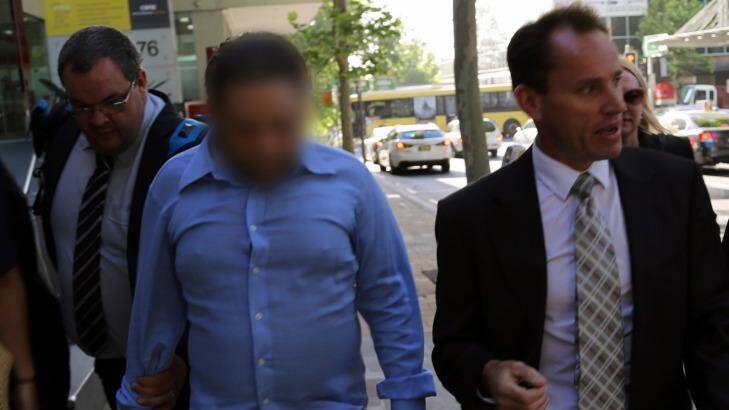 Ian Lazar is arrested in North Sydney on Thursday by detectives from Strike Force McMaster. Photo: Police Media