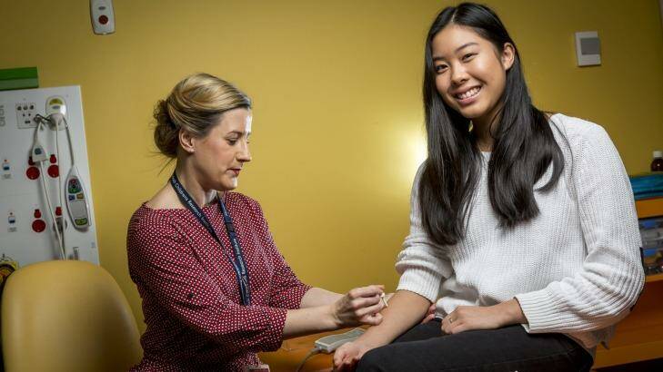 Caitlin Louey, 16, who has suffered from anaphylaxis to pecan nuts undergoes allergy testing from research nurse Holly Shaw as a part of SchoolNuts, a Murdoch Children's Research Institute study.  Photo: Eddie Jim