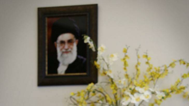 Detente: Julie Bishop under a portrait of Iran’s Supreme Leader Ayatollah Ali Khamenei.  Photo: Andrew Meares