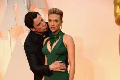 John Travolta and Scarlett Johansson attend the 87th Annual Academy Awards at Hollywood & Highland Center. Photo: Kevin Mazur/Wireimage