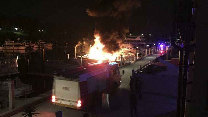 The fire takes hold of two boats at Woolloomooloo on Saturday. Photo: Julian Peterson