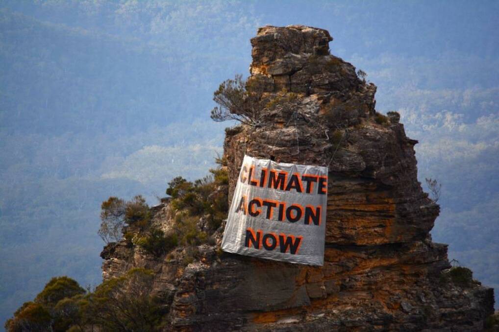 One sister's opinion: a banner hung by climate activists in the Blue Mountains on Sunday. Photo: Ireni Clarke