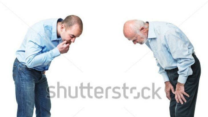 The same man, right, can be found in the Shutterstock collection under the keywords "two man look at snail race".  Photo: Shutterstock