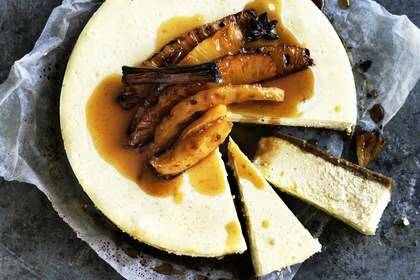 Vanilla and ginger cheesecake with spiced roast pineapple. Photo: William Meppem