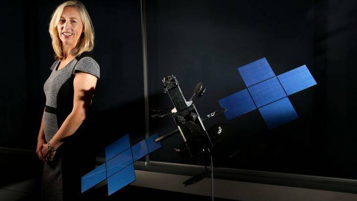 Satellite architect Julia Dickinson with a model of an NBN Co broadband satellite. Photo: Wayne Taylor