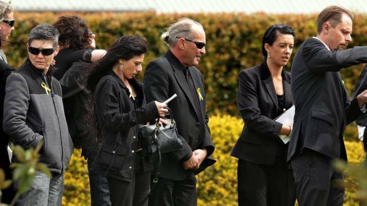 Carly McBride's father, Steve McBride (centre), at the funeral service. Photo: Simone De Peak