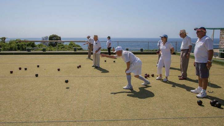 A group of retired Italian-Australians enjoy the sea air and view over a game of bocce at Clovelly. Photo: Michele Mossop