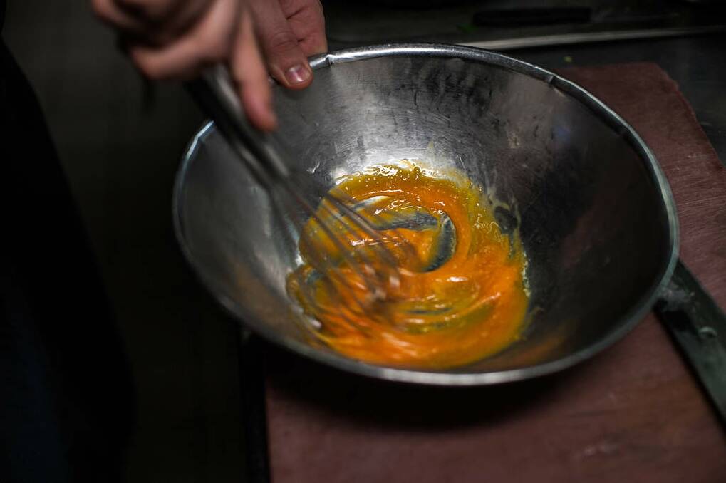 Step 2: Whisk until pale and fluffy. Mixture should reach temperature of 62C. Photo: Josh Robenstone/Getty Images