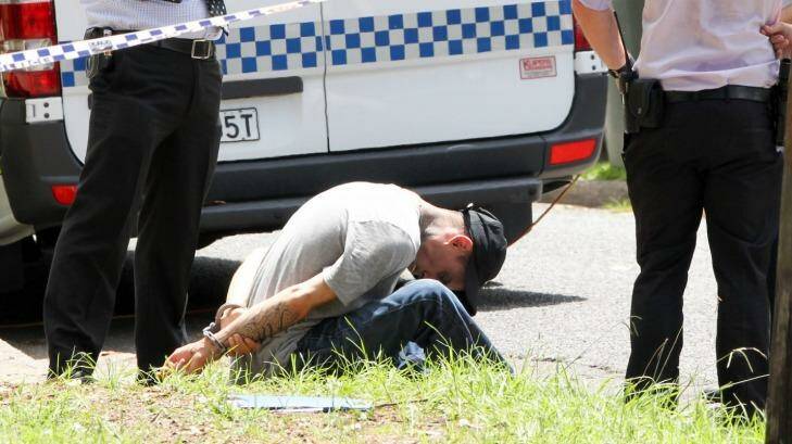Sharon Michelutti's son, Blake Michelutt,i is restrained after turning up to the house in Riverwood and learning of her mother's alleged murder. Photo: Janie Barrett