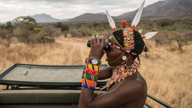 A Sarara Camp lodge guide searches for wildlife. Photo: Alamy 