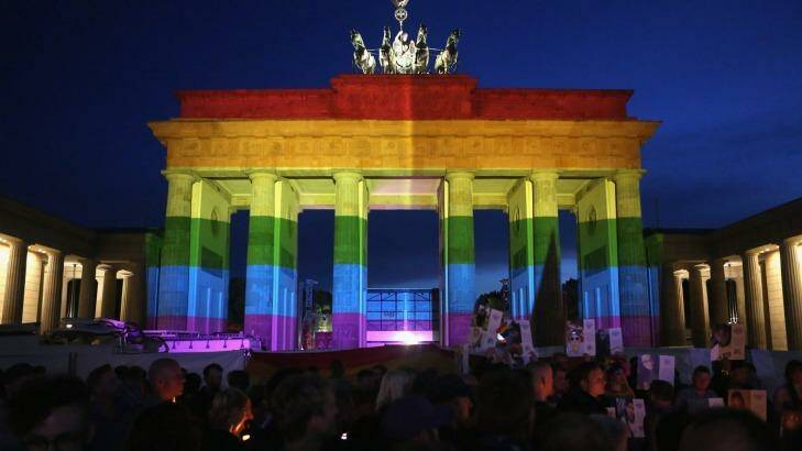 The Brandenburg Gate in Germany is seen with a rainbow flag projected onto it during a vigil for victims of the Orlando, Florida nightclub shooting.  Photo: Adam Berry
