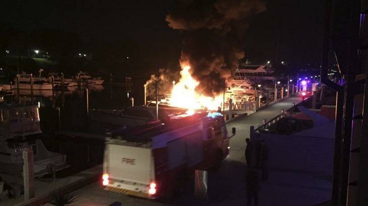 Yachts ablaze at Woolloomooloo's Finger Wharf. Photo: Julian Peterson