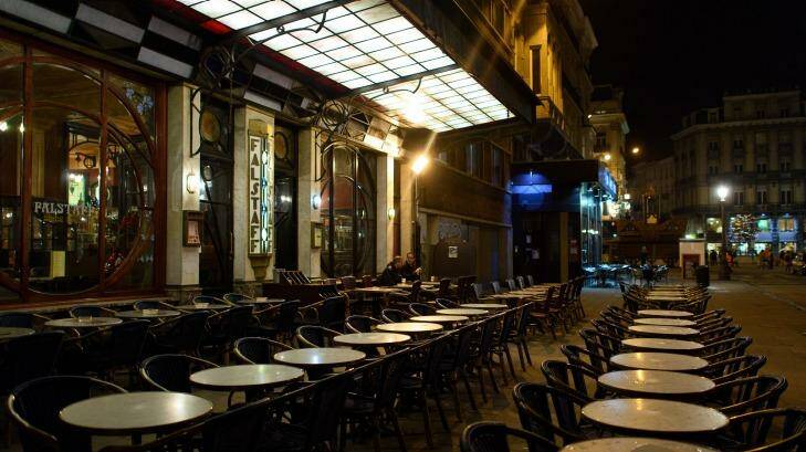 Empty tables outside a restaurant on Rue Henri Maus in Brussels on Monday.  Photo: Ben Pruchnie
