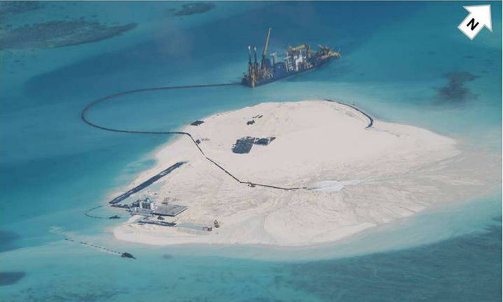 A February 2014 photo taken by surveillance planes for the Philippines government shows Chinese construction work on Johnson Reef in the disputed Spratly Islands.  Photo: Philippines Department of Foreign Affairs