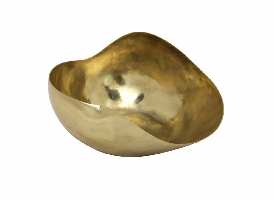 Medium Seed Pod bowl in brass, $210, dinosaurdesigns.com.au. Photo: Supplied