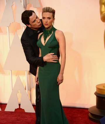 John Travolta and Scarlett Johansson attend the 87th Annual Academy Awards at Hollywood & Highland Center. Photo: Kevin Mazur/Wireimage