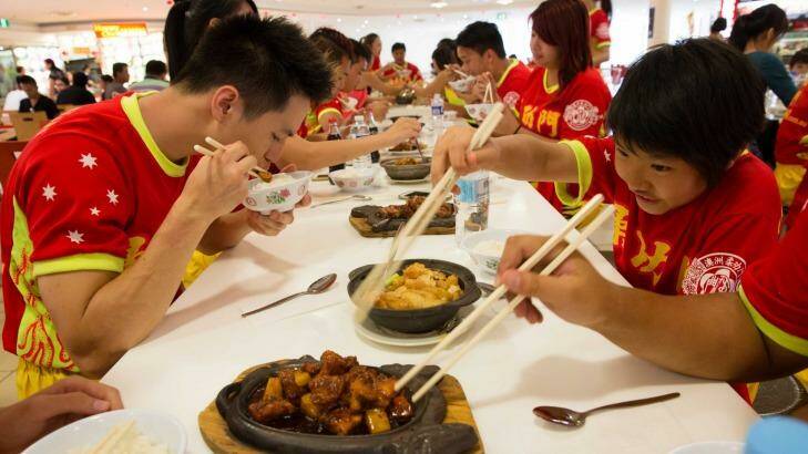 Time to feed the Yau Kung Mun martial arts club, which has operated in Sydney for 35 years. The club's lion dance troupe will perform at over 80 events during this Chinese New Year. Photo: Shu Yeung
