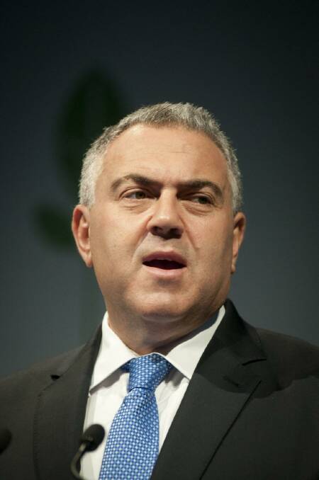 Treasurer Joe Hockey unveiled a PowerPoint presentation on the upcoming budget to Coalition MPs on Tuesday. Photo: Robert Shakespeare