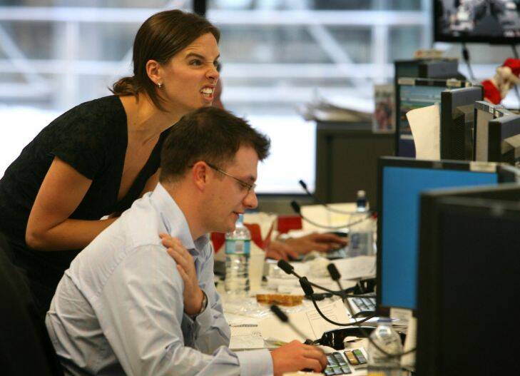 Traders on the dealing floor of the Westpac Bank in Kent Street, Sydney, watch as the Australian sharemarket continued its downward slide, crashing to its largest one-day fall in more than 18 years as more than A$104 billion was wiped off Australian stocks as panic selling gripped investors, 22 January 2008.
SMH Picture by PETER MORRIS
