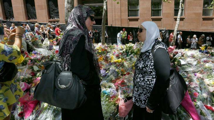 Latife Bahsoun of Roselands with a friend at Martin Place to pay tribute to the victims of the Lindt Cafe siege. Photo: Michele Mossop