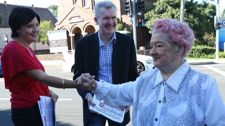 Strathfield labor candidate Jodi McKay,  with MP Tony Burke, meets a supporter. Photo: Louise Kennerley