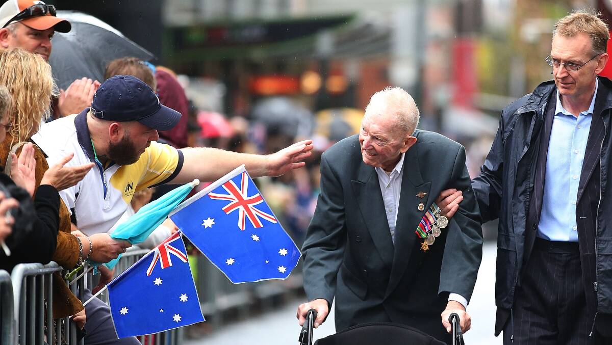 A war veteran makes his way down Bathurst Street, Sydney during the city's Anzac Day parade yesterday. Picture: Getty Images.
