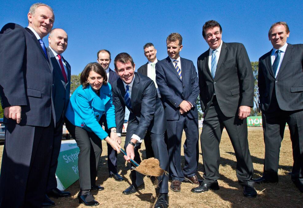 Making ground: Riverstone MP Kevin Conolly (from left), Baulkham Hills MP David Elliott, Transport Minister Gladys Berejikilian, Hornsby MP Matt Kean, Premier Mike Baird, The Hills councillor Mark Taylor, Treasurer Andrew Constance, Hawkesbury MP Ray Williams and Londonderry MP Bart Bassett. Picture: Geoff Jones