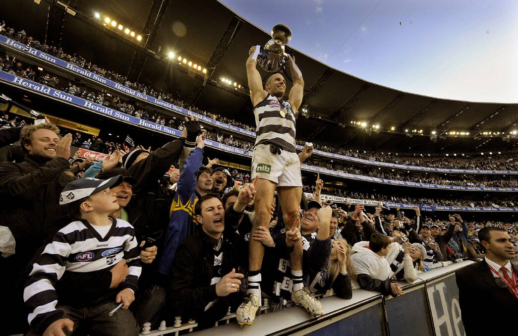 Tom Harley celebrates the Cats win in 2009. Fairfax photos.