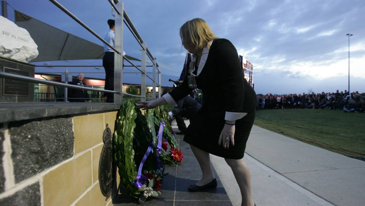 This Hills mayor Michelle Byrne lays a wreath. Picture: Gene Ramirez