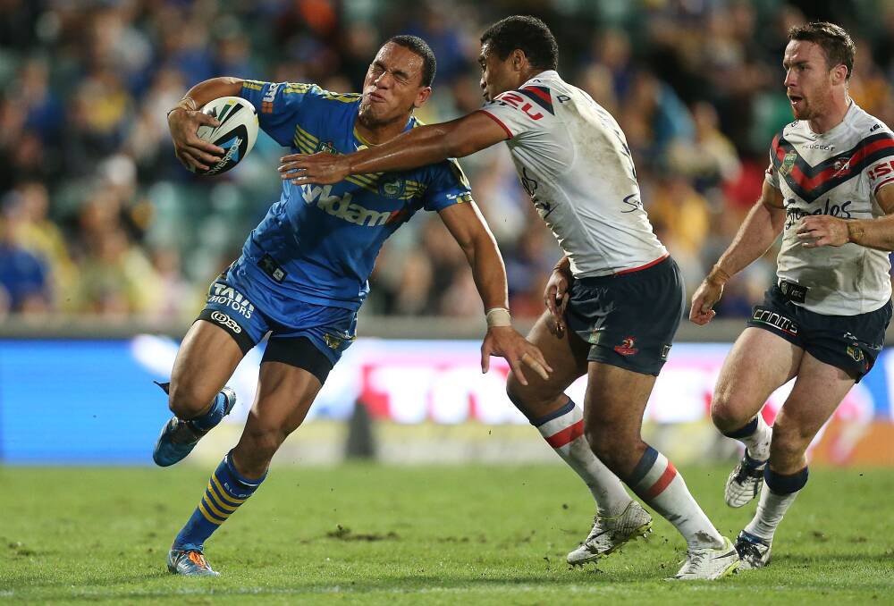 SYDNEY, AUSTRALIA - APRIL 12: Will Hopoate of the Eels is tackled by Michael Jennings of the Roosters during the round 6 NRL match between the Parramatta Eels and the Sydney Roosters at Pirtek Stadium on April 12, 2014 in Sydney, Australia. (Photo by Mark Metcalfe/Getty Images)