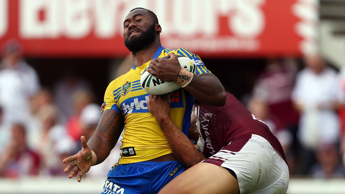 SYDNEY, AUSTRALIA - MARCH 23: Semi Radradra is tackled by Tony Satini during the round three NRL match between the Manly-Warringah Sea Eagles and the Parramatta Eels at Brookvale Oval on March 23, 2014 in Sydney, Australia. (Photo by Renee McKay/Getty Images)