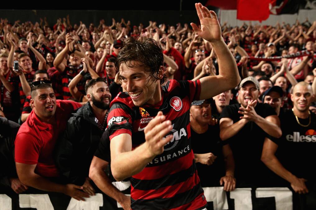 SYDNEY, AUSTRALIA - APRIL 26: Mateo Poljak of the Wanderers celebrates with fans after winning the A-League Semi Final match between the Western Sydney Wanderers and the Central Coast Mariners at Pirtek Stadium on April 26, 2014 in Sydney, Australia. (Photo by Cameron Spencer/Getty Images)