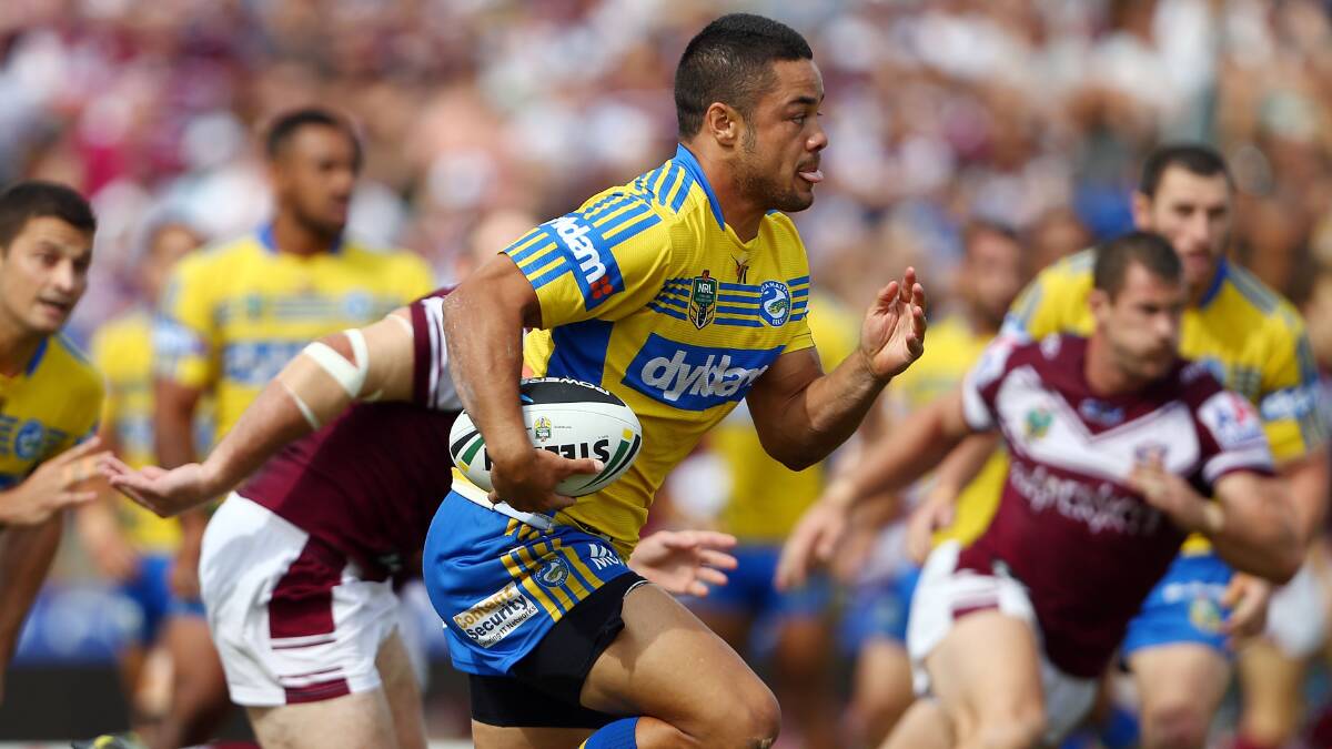 SYDNEY, AUSTRALIA - MARCH 23: Jarryd Hayne makes a break for the Eels during the round three NRL match between the Manly-Warringah Sea Eagles and the Parramatta Eels at Brookvale Oval on March 23, 2014 in Sydney, Australia. (Photo by Renee McKay/Getty Images)