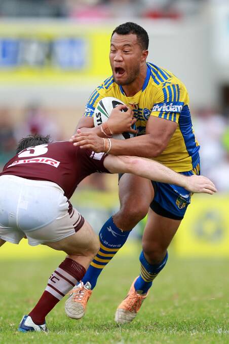 SYDNEY, AUSTRALIA - MARCH 23: Joseph Paulo of the Eels is tackled during the round three NRL match between the Manly-Warringah Sea Eagles and the Parramatta Eels at Brookvale Oval on March 23, 2014 in Sydney, Australia. (Photo by Matt Blyth/Getty Images)
