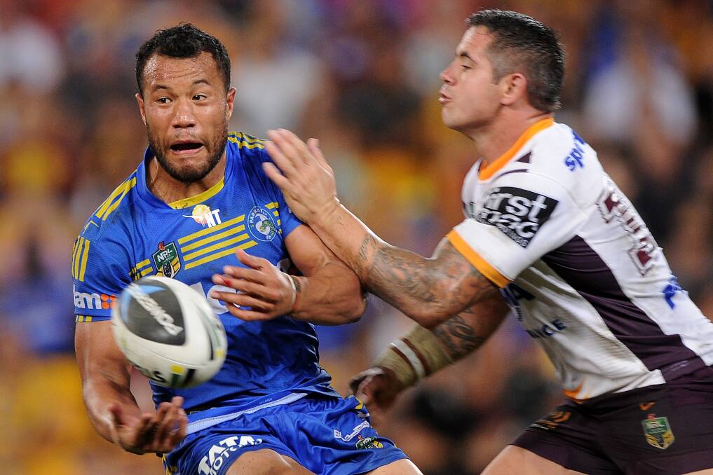 BRISBANE, AUSTRALIA - APRIL 04: Joseph Paulo of the Eels passes the ball during the round five NRL match between the Brisbane Broncos and Parramatta Eels at Suncorp Stadium on April 4, 2014 in Brisbane, Australia. (Photo by Matt Roberts/Getty Images)