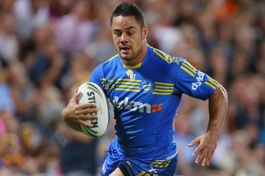 BRISBANE, AUSTRALIA - APRIL 04: Jarryd Hayne of the Eels makes a break to score a try during the round five NRL match between the Brisbane Broncos and Parramatta Eels at Suncorp Stadium on April 4, 2014 in Brisbane, Australia. (Photo by Chris Hyde/Getty Images)