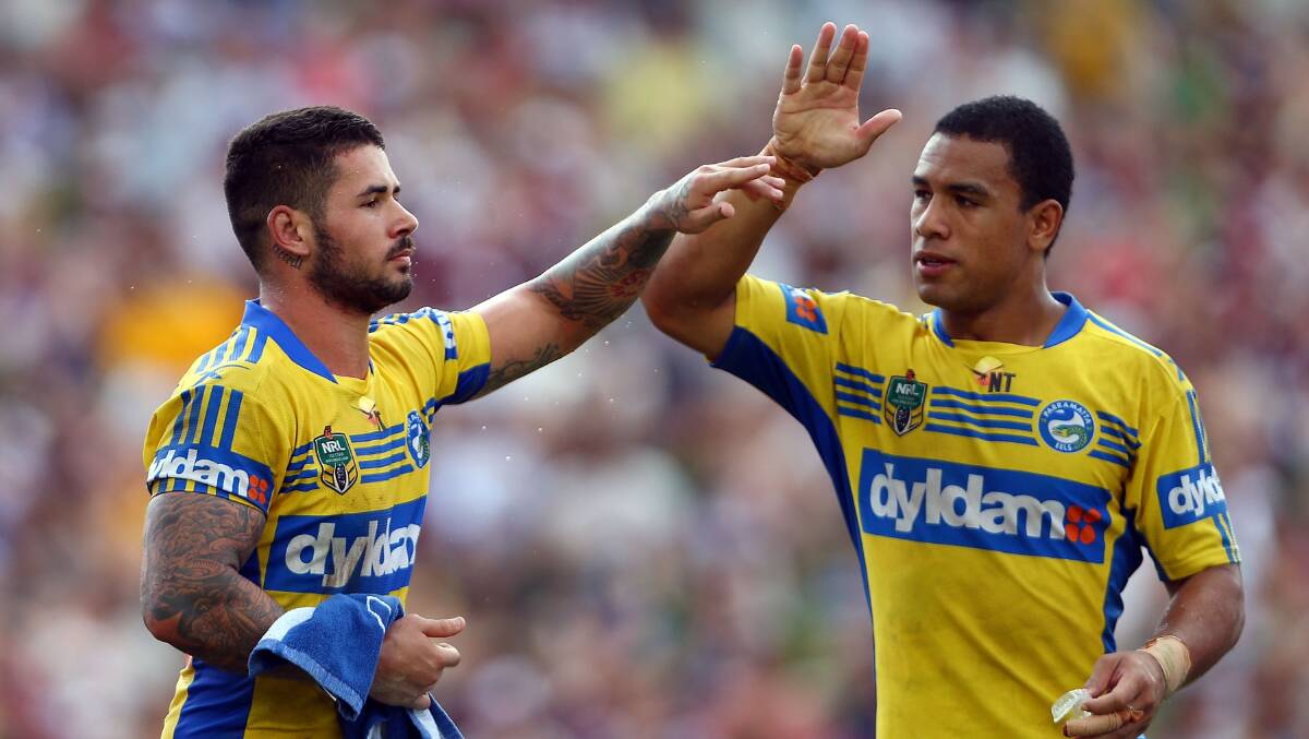 SYDNEY, AUSTRALIA - MARCH 23: Nathan Peats of the Eels celebrates his try with Will Hopoate during the round three NRL match between the Manly-Warringah Sea Eagles and the Parramatta Eels at Brookvale Oval on March 23, 2014 in Sydney, Australia. (Photo by Renee McKay/Getty Images)