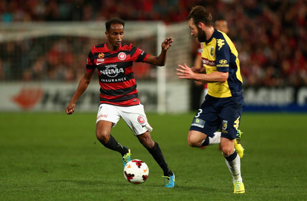 SYDNEY, AUSTRALIA - APRIL 26: Youssouf Hersi of the Wanderers controls the ball ahead of Josh Rose of the Mariners during the A-League Semi Final match between the Western Sydney Wanderers and the Central Coast Mariners at Pirtek Stadium on April 26, 2014 in Sydney, Australia. (Photo by Cameron Spencer/Getty Images)