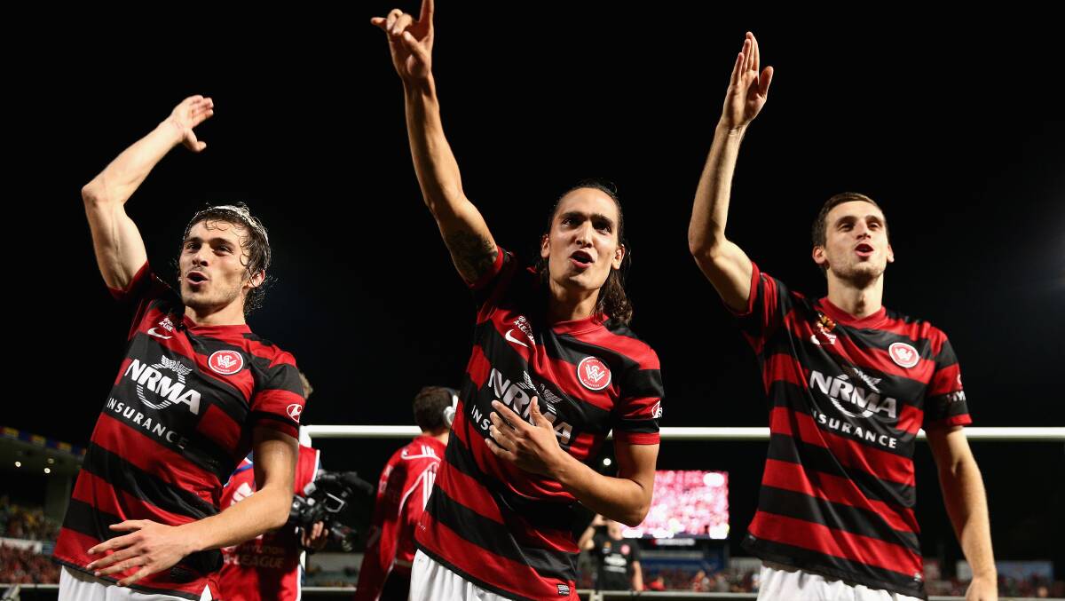 SYDNEY, AUSTRALIA - APRIL 26: Wanderers players celebrate winning the A-League Semi Final match between the Western Sydney Wanderers and the Central Coast Mariners at Pirtek Stadium on April 26, 2014 in Sydney, Australia. (Photo by Cameron Spencer/Getty Images)