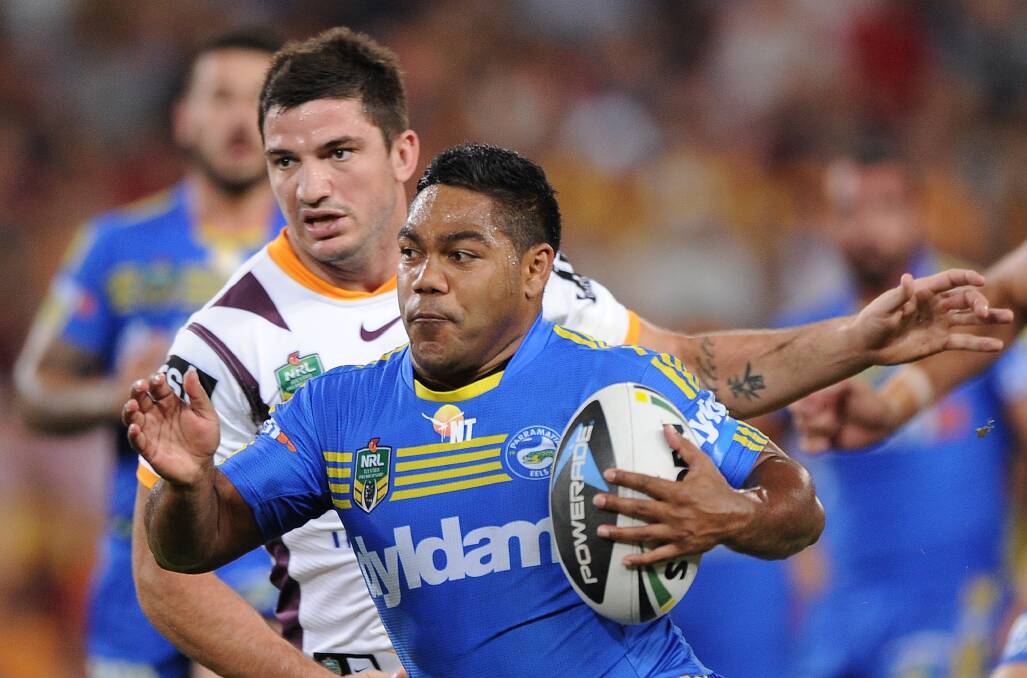 BRISBANE, AUSTRALIA - APRIL 04: Chris Sandow of the Eels takes on the defence during the round five NRL match between the Brisbane Broncos and Parramatta Eels at Suncorp Stadium on April 4, 2014 in Brisbane, Australia. (Photo by Matt Roberts/Getty Images)