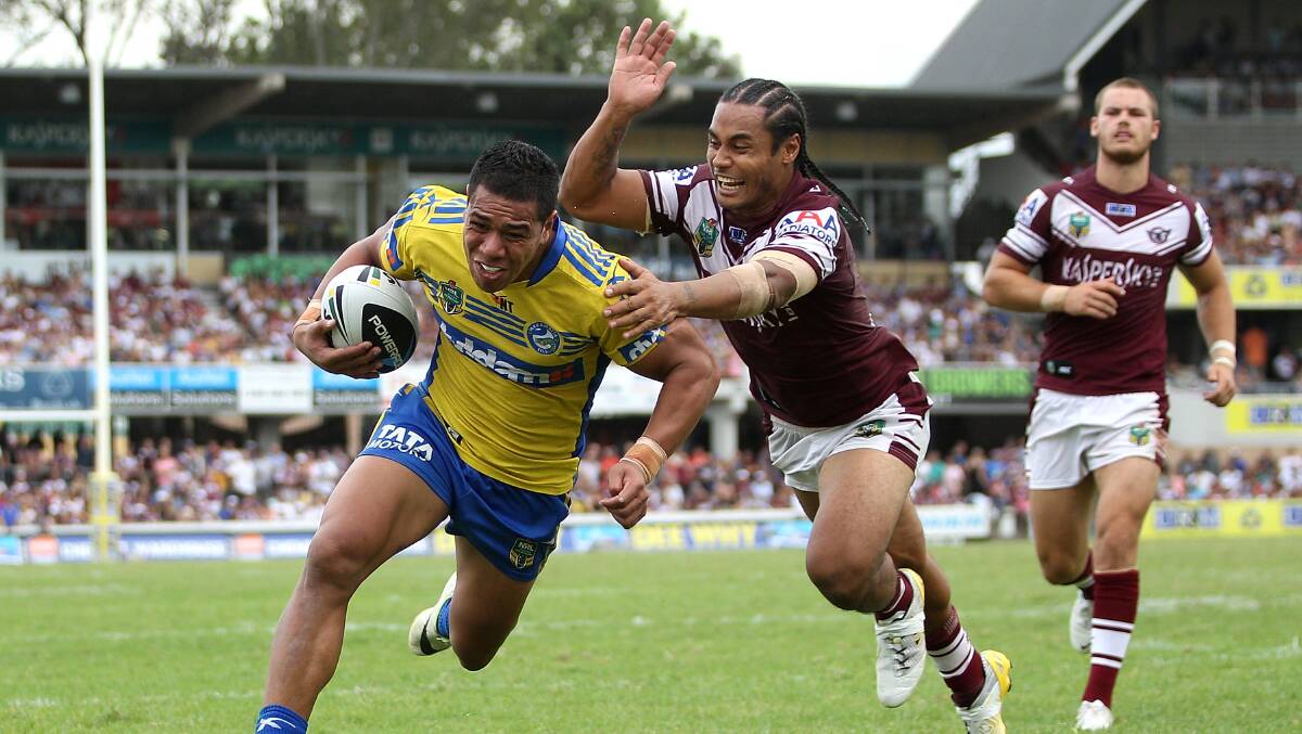 SYDNEY, AUSTRALIA - MARCH 23: Vai Toutai of the Eels scores a try during the round three NRL match between the Manly-Warringah Sea Eagles and the Parramatta Eels at Brookvale Oval on March 23, 2014 in Sydney, Australia. (Photo by Matt Blyth/Getty Images)