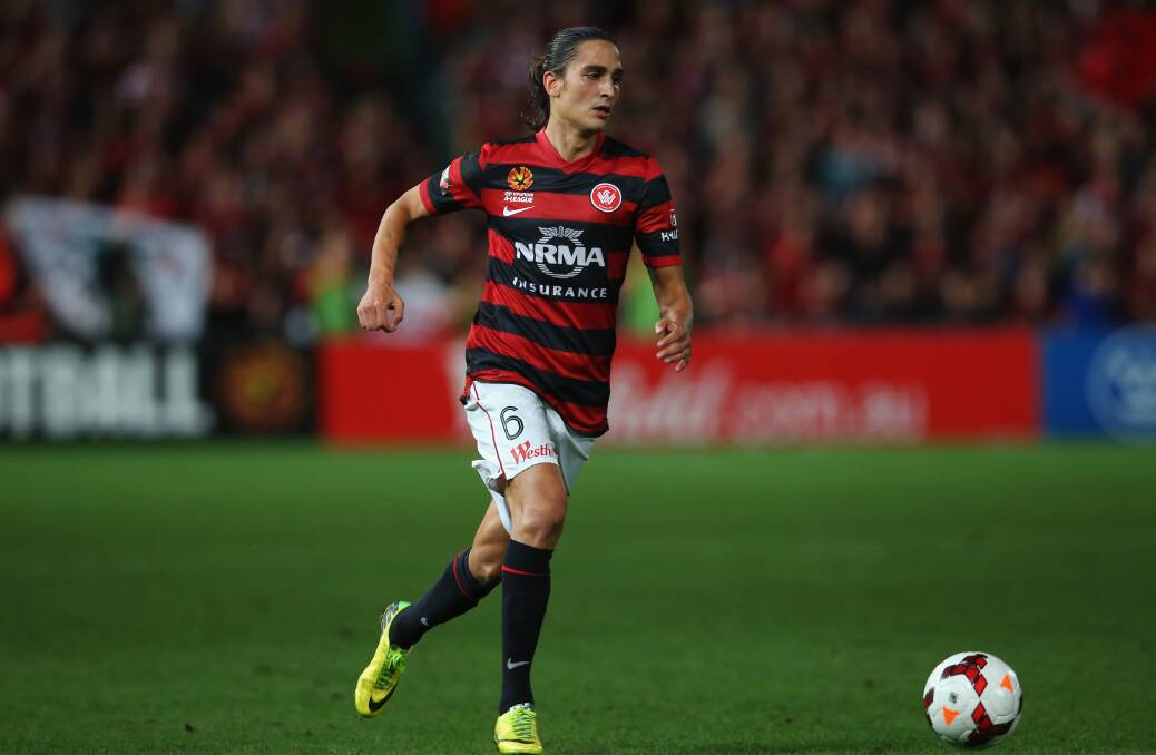 SYDNEY, AUSTRALIA - APRIL 26: Jerome Polenz of the Wanderers runs with the ball during the A-League Semi Final match between the Western Sydney Wanderers and the Central Coast Mariners at Pirtek Stadium on April 26, 2014 in Sydney, Australia. (Photo by Mark Kolbe/Getty Images)