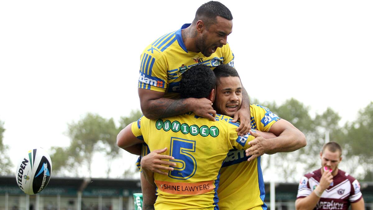 SYDNEY, AUSTRALIA - MARCH 23: Vai Toutai #5 of the Eels celebrates scoring a try during the round three NRL match between the Manly-Warringah Sea Eagles and the Parramatta Eels at Brookvale Oval on March 23, 2014 in Sydney, Australia. (Photo by Matt Blyth/Getty Images)