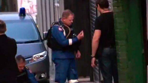 Police conduct a search in Surry Hills. Photo: Channel 9 News